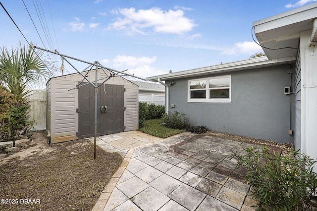 view of patio featuring a shed