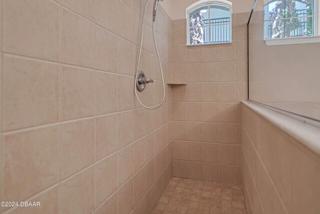 bathroom featuring tiled shower