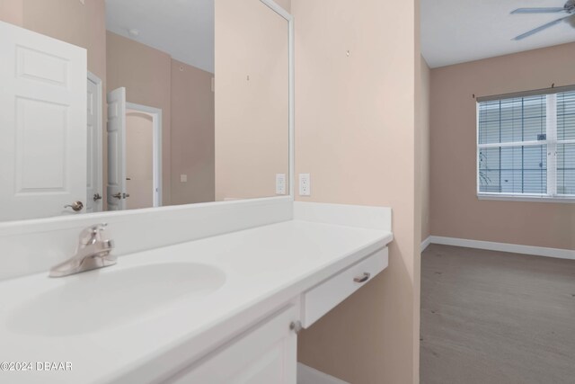 bathroom featuring ceiling fan and vanity