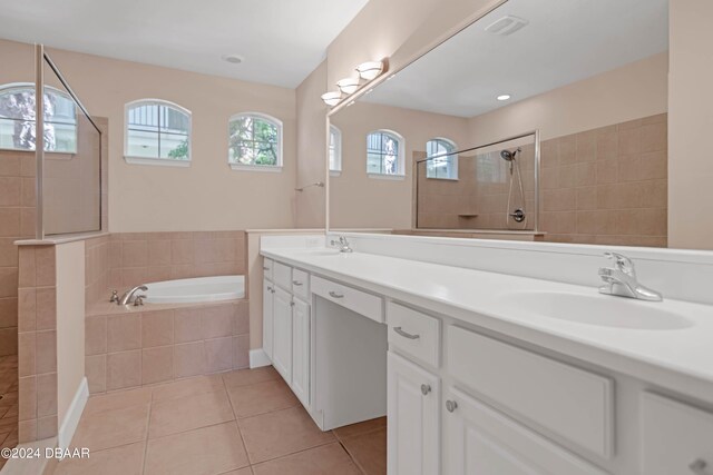 bathroom featuring vanity, plenty of natural light, tile patterned floors, and separate shower and tub