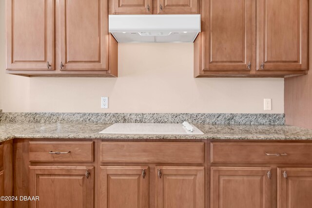 kitchen featuring light stone counters