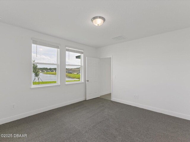 173 Links Terrace Blvd, Daytona Beach, FL 32124 - unfurnished room with dark carpet and baseboards