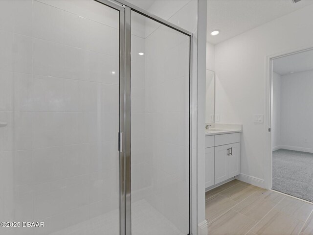 173 Links Terrace Blvd, Daytona Beach, FL 32124 - bathroom with vanity, a shower stall, recessed lighting, and baseboards