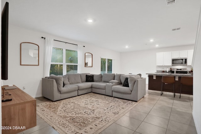 living room with light tile patterned floors