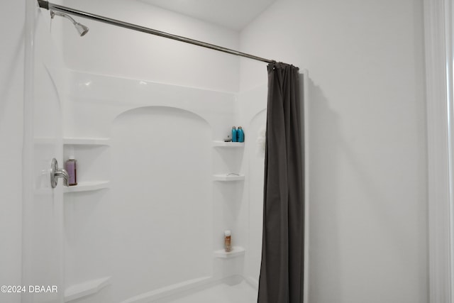 bathroom featuring walk in shower