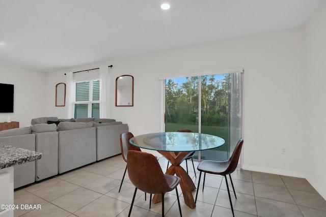 dining area featuring light tile patterned floors