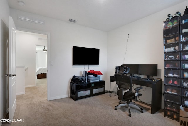 office featuring light colored carpet and ceiling fan