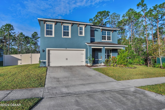 view of front of house featuring a garage and a front yard