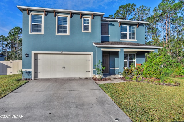 view of front of house featuring a garage and a front yard