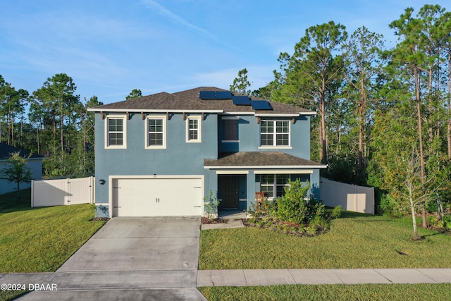 view of front of home with solar panels, a front lawn, and a garage