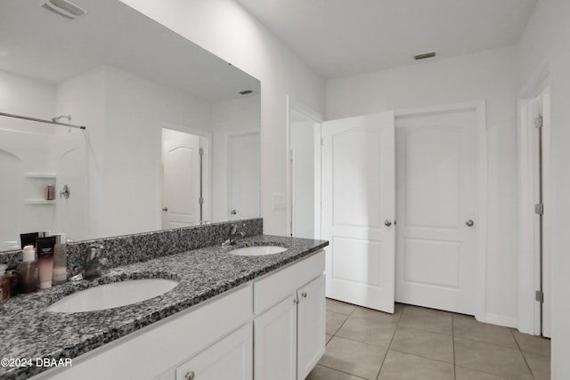 bathroom with vanity and tile patterned floors