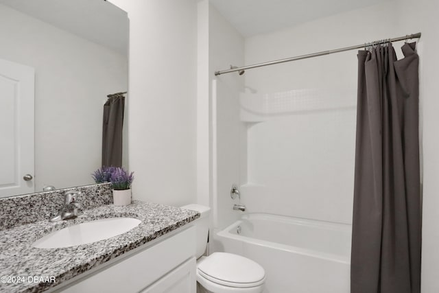 full bathroom featuring toilet, shower / tub combo, and vanity