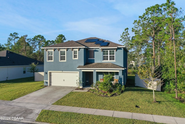 front facade featuring a garage, a front yard, and solar panels