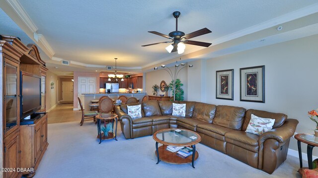 2403 S Atlantic Ave Unit 1210, Daytona Beach Shores, FL 32118 - living room with light carpet, a chandelier, a tray ceiling, crown molding, and a ceiling fan