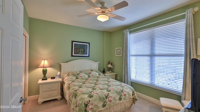 carpeted bedroom with ceiling fan