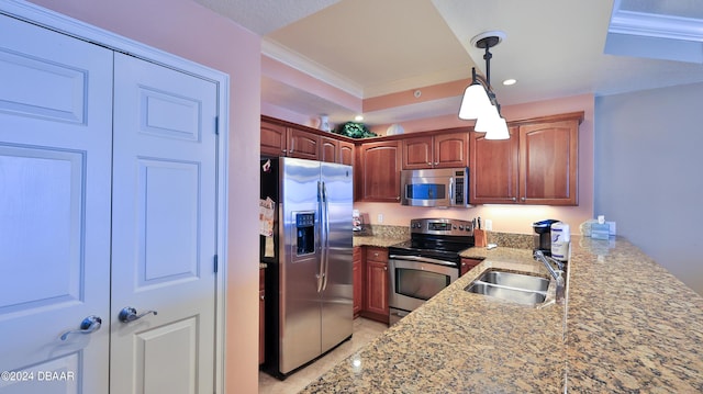 2403 S Atlantic Ave Unit 1210, Daytona Beach Shores, FL 32118 - kitchen featuring appliances with stainless steel finishes, a sink, light stone counters, hanging light fixtures, and ornamental molding