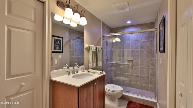 bathroom with walk in shower, tile patterned flooring, vanity, and toilet