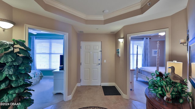 2403 S Atlantic Ave Unit 1210, Daytona Beach Shores, FL 32118 - entryway with ornamental molding, a raised ceiling, baseboards, and light tile patterned floors