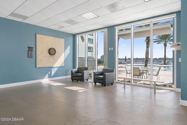 231 Riverside Dr Unit 1209-1, Daytona Beach, FL 32117 - lobby featuring floor to ceiling windows, a water view, and a paneled ceiling