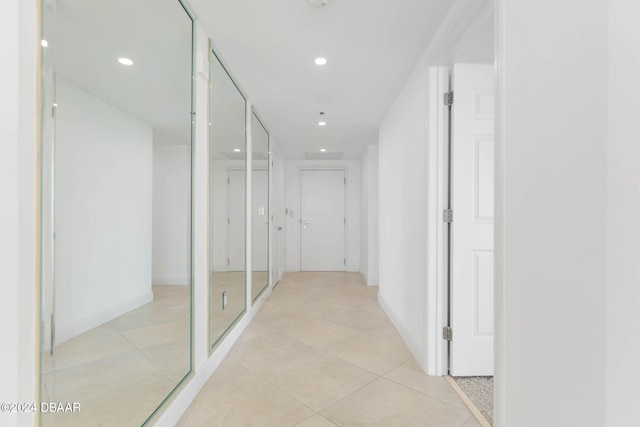 231 Riverside Dr Unit 1209-1, Daytona Beach, FL 32117 - corridor with recessed lighting, light tile patterned flooring, and baseboards