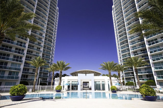 231 Riverside Dr Unit 1209-1, Daytona Beach, FL 32117 - community pool with fence and a patio area
