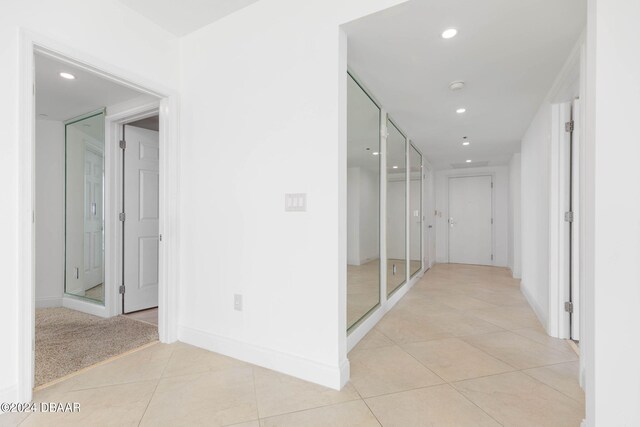 231 Riverside Dr Unit 1209-1, Daytona Beach, FL 32117 - corridor featuring light tile patterned flooring, baseboards, and recessed lighting