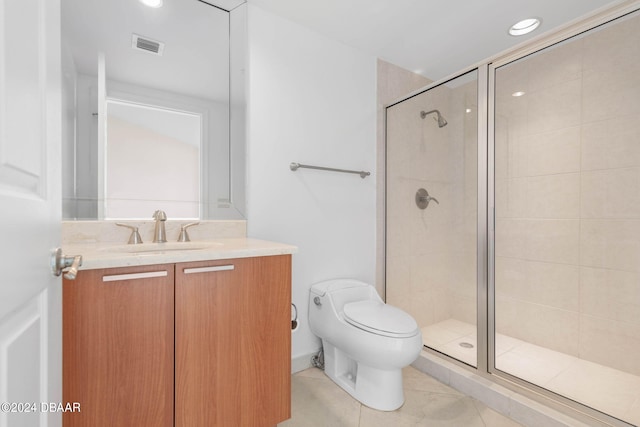 bathroom featuring walk in shower, toilet, vanity, and tile patterned floors