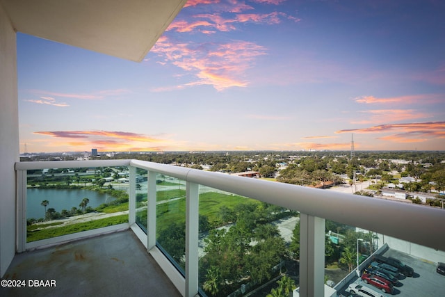 231 Riverside Dr Unit 1209-1, Daytona Beach, FL 32117 - balcony at dusk featuring a water view