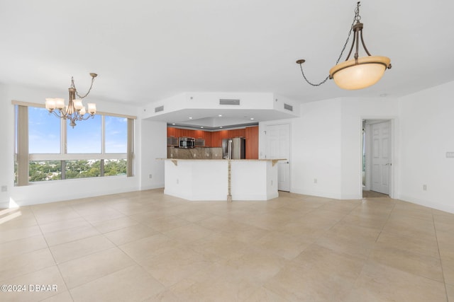 unfurnished living room with a chandelier and light tile patterned floors