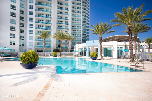 view of swimming pool with a patio area