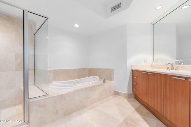 bathroom featuring vanity, tile patterned floors, and separate shower and tub