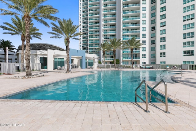 231 Riverside Dr Unit 1209-1, Daytona Beach, FL 32117 - community pool with fence and a patio area
