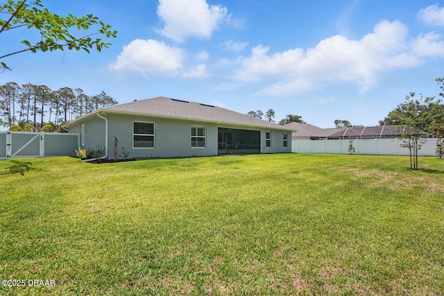 70 Esperanto Dr, Palm Coast, FL 32164 - back of house featuring a fenced backyard, stucco siding, and a gate