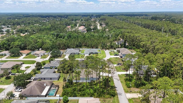 70 Esperanto Dr, Palm Coast, FL 32164 - aerial perspective of suburban area with a heavily wooded area