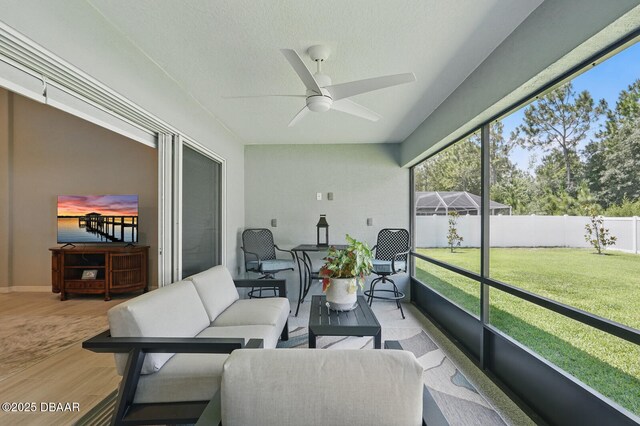 70 Esperanto Dr, Palm Coast, FL 32164 - sunroom / solarium featuring a ceiling fan, plenty of natural light, and an outdoor hangout area