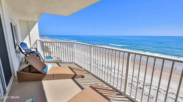 4601 S Atlantic Ave Unit 702, Ponce Inlet, FL 32127 - balcony featuring a water view and a view of the beach