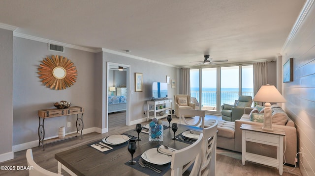 4601 S Atlantic Ave Unit 702, Ponce Inlet, FL 32127 - living area featuring ceiling fan, visible vents, and ornamental molding