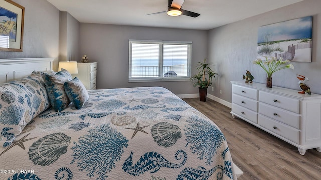 4601 S Atlantic Ave Unit 702, Ponce Inlet, FL 32127 - bedroom featuring baseboards, a ceiling fan, and wood finished floors