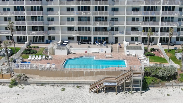 4601 S Atlantic Ave Unit 702, Ponce Inlet, FL 32127 - community pool featuring a patio