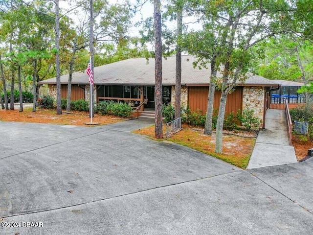 111 Grey Branch Rd, Port Orange, FL 32128 - view of front of home with stone siding and a porch