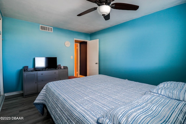 bedroom with dark wood-type flooring and ceiling fan