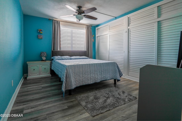 bedroom featuring dark wood-type flooring and ceiling fan