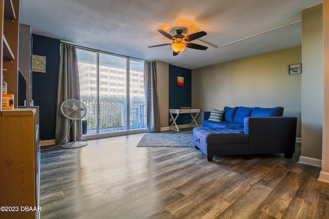 living room featuring dark hardwood / wood-style floors and ceiling fan