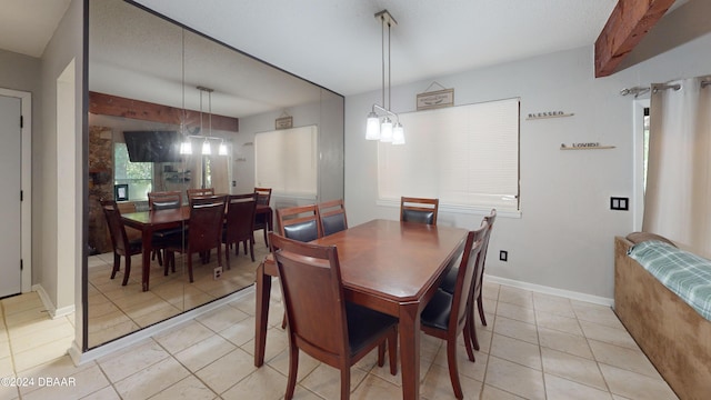 167 Fox Glen Ct, Ormond Beach, FL 32174 - tiled dining room with beamed ceiling and a textured ceiling