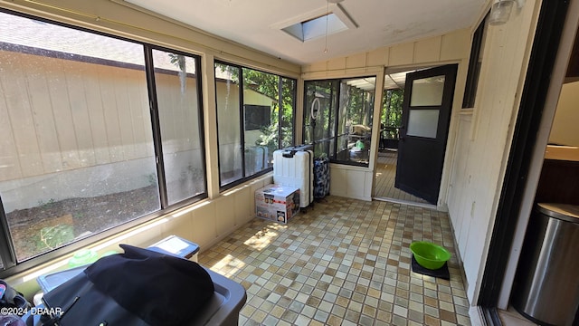 167 Fox Glen Ct, Ormond Beach, FL 32174 - sunroom featuring a skylight