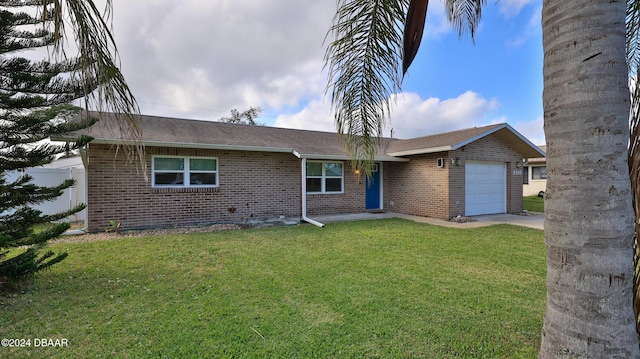 ranch-style home with a front lawn and a garage