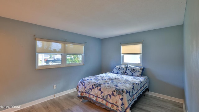 bedroom featuring hardwood / wood-style flooring