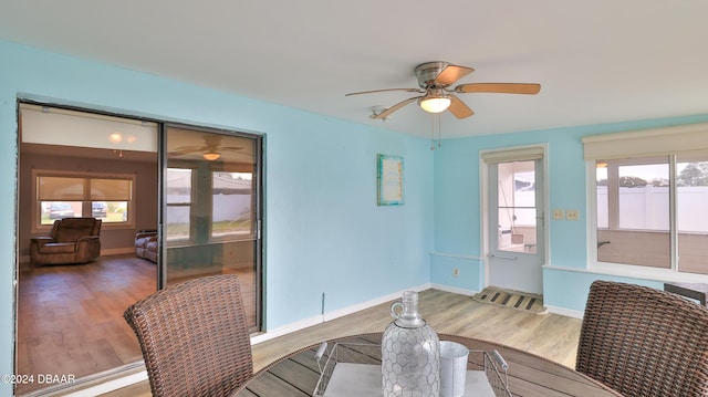 dining space featuring hardwood / wood-style flooring and ceiling fan