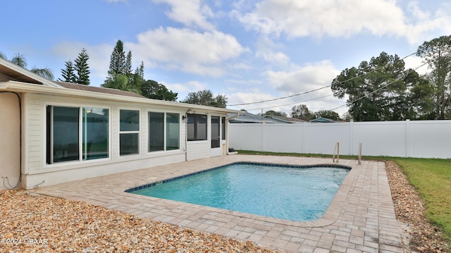 view of pool with a patio area, a fenced backyard, and a fenced in pool