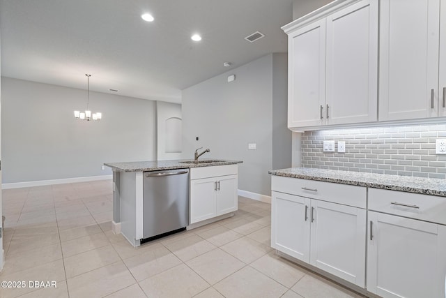 136 Longridge Ln, Ormond Beach, FL 32174 - kitchen with dishwasher, a sink, baseboards, decorative backsplash, and light tile patterned flooring